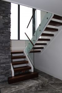 walnut stair with glass balustrade