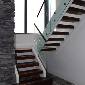 walnut stair with glass balustrade