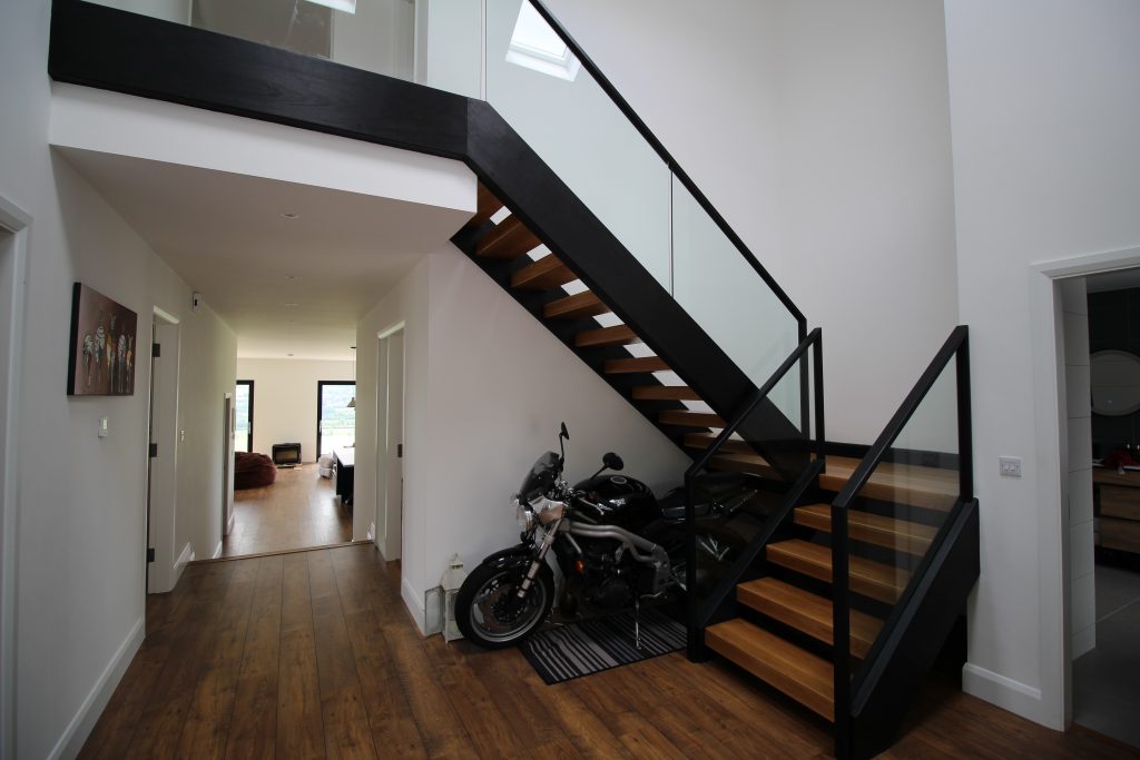 Stair rails is often the distinguishing feature of a staircase. There are many types of railing available including a variety of designs, colors, and material.  However oak ans glass is a good choice for adding a touch of sophistication to your stair decor